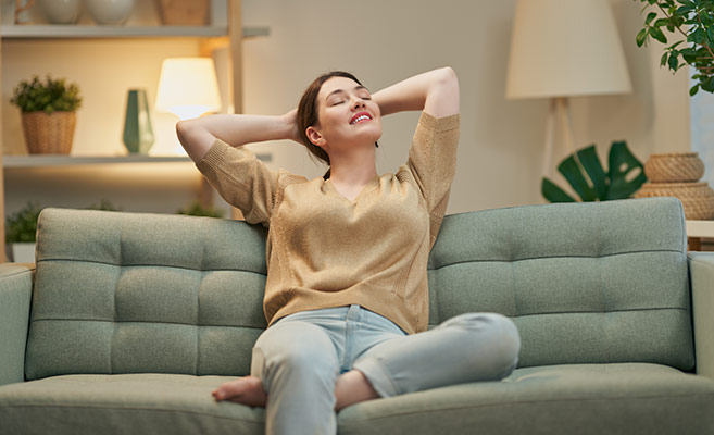 Woman resting on sofa